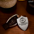 Custom engraved shield keychain paired with a Mercedes-Benz key