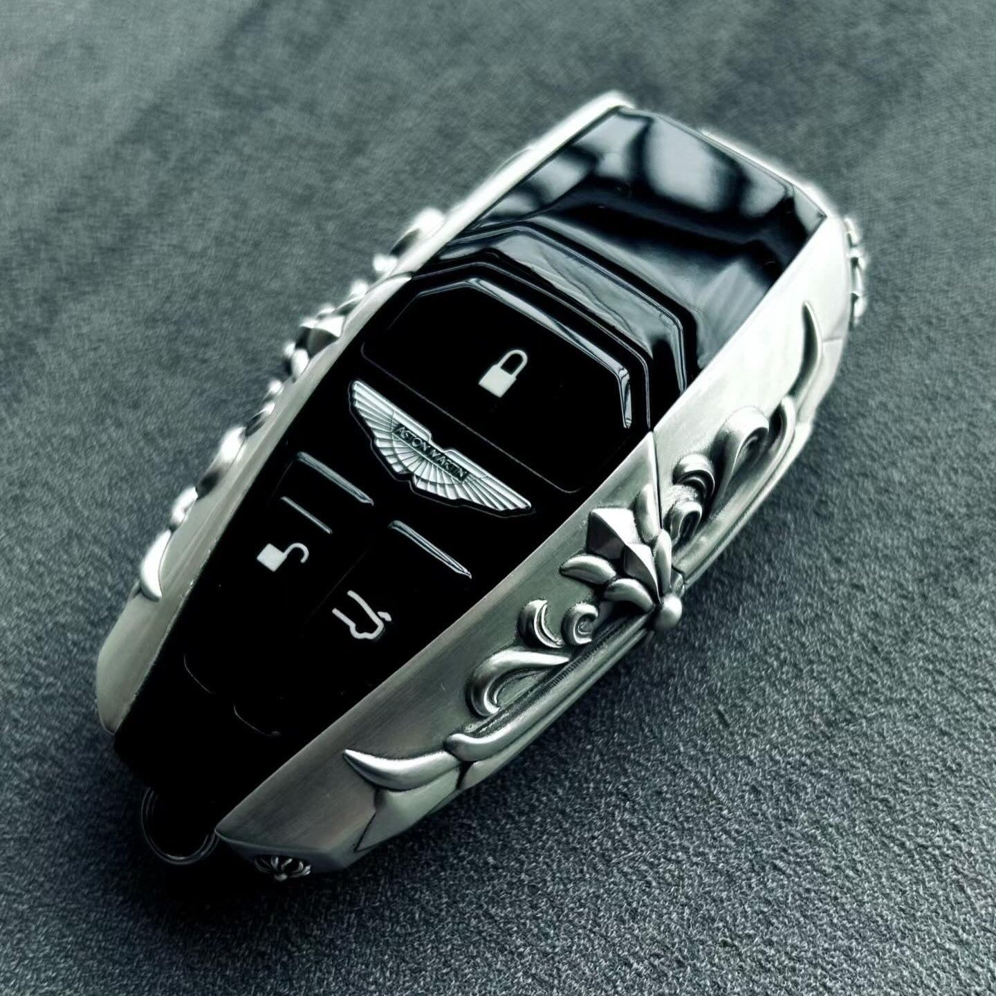 Bespoke 925 Sterling Silver key shell featuring intentional scrollwork engraving, hand-finished surface with refined patina, precision fit guarantee