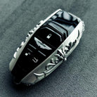 Bespoke 925 Sterling Silver key shell featuring intentional scrollwork engraving, hand-finished surface with refined patina, precision fit guarantee