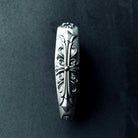 Side profile of bespoke solid silver key shell, revealing refined edges, precision fit guarantee, and considerable presence in hand
