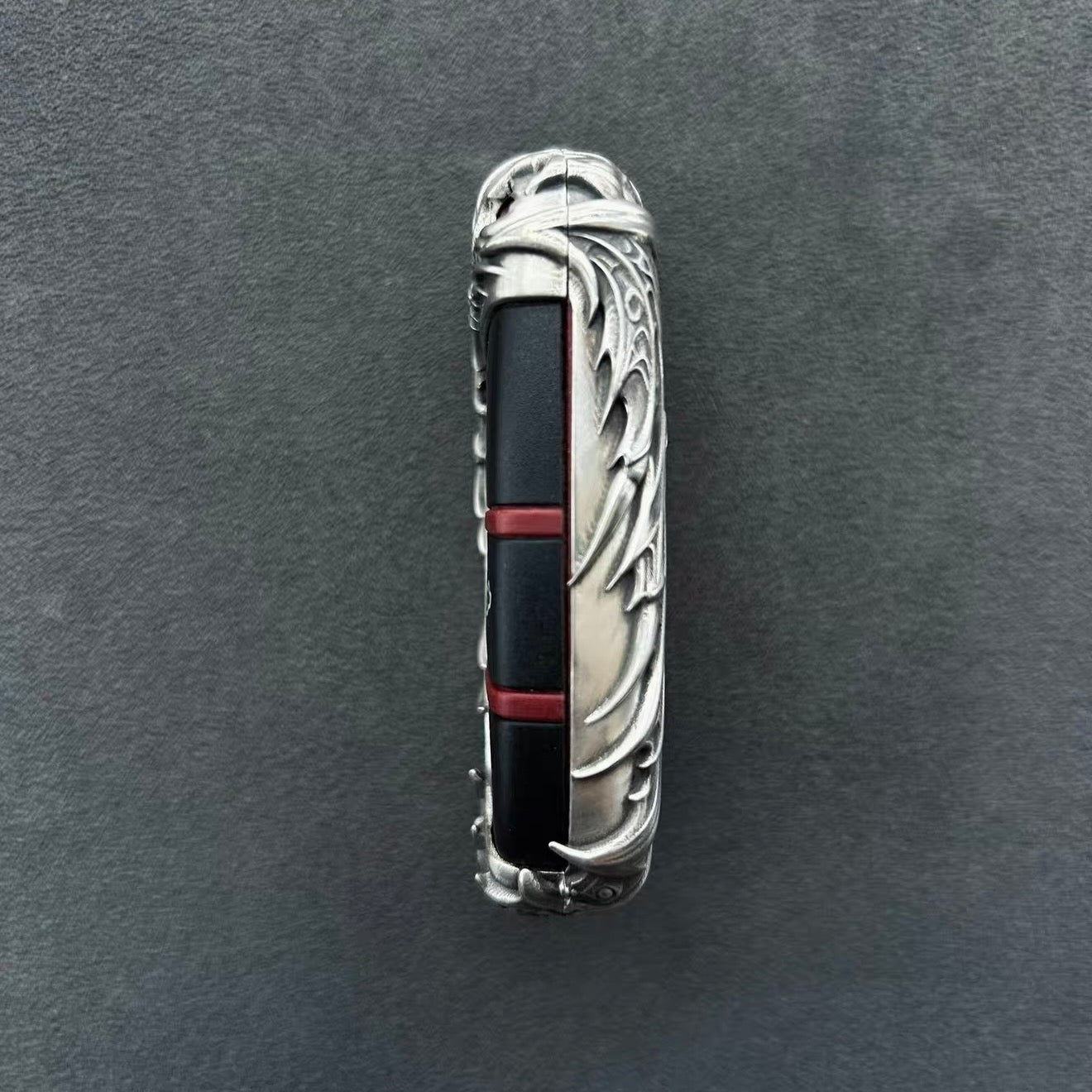 Interior view of Dodge sterling silver key case showing red accent strip matching original panic button color, seamless fit for factory key fob and precision craftsmanship