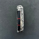 Interior view of Dodge sterling silver key case showing red accent strip matching original panic button color, seamless fit for factory key fob and precision craftsmanship