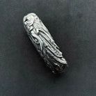 Side profile of Dodge handcrafted sterling silver key case highlighting three-dimensional dragon body engraving, sculpted edges and intentional weight (90g) with heirloom quality