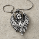 Fallen Angel Blindfolded Pendant, displayed on a dark surface