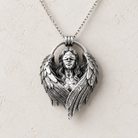 Fallen Angel Blindfolded Pendant, held for scale