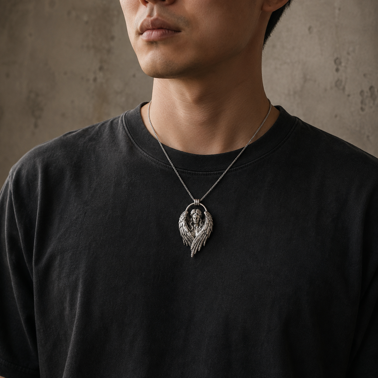 Fallen Angel Blindfolded Pendant, worn on a chain