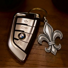 Flower-de-Luce 925 Silver Necklace, front view beside a car key