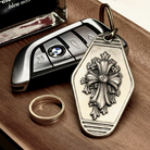 Gothic Fleur Cross Silver Keychain, front view beside a car key