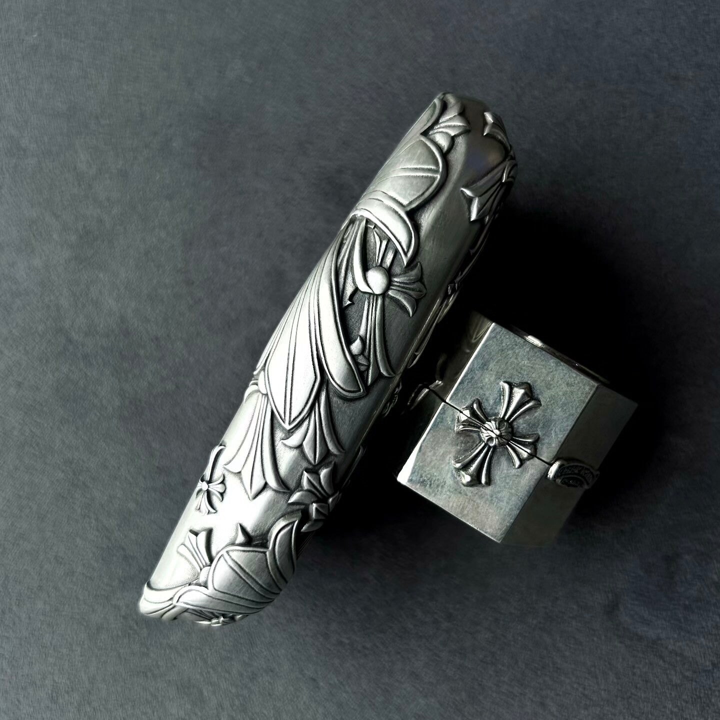 Close-up of intricate faceted blade engraving on handcrafted solid silver surface