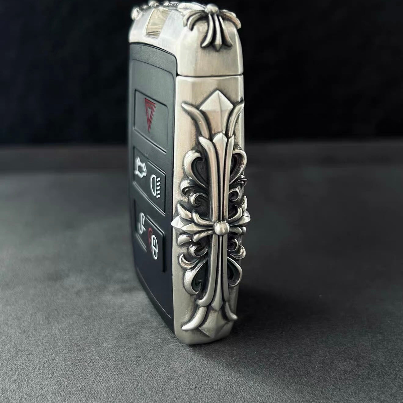 Close-up of intricate floral scrollwork engraving on handcrafted solid silver surface