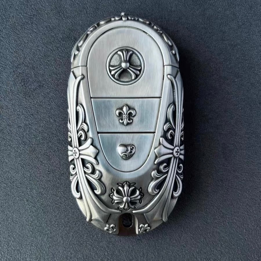 Close-up of intricate floral scrollwork engraving on handcrafted solid silver surface