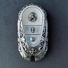 Close-up of intricate floral scrollwork engraving on handcrafted solid silver surface