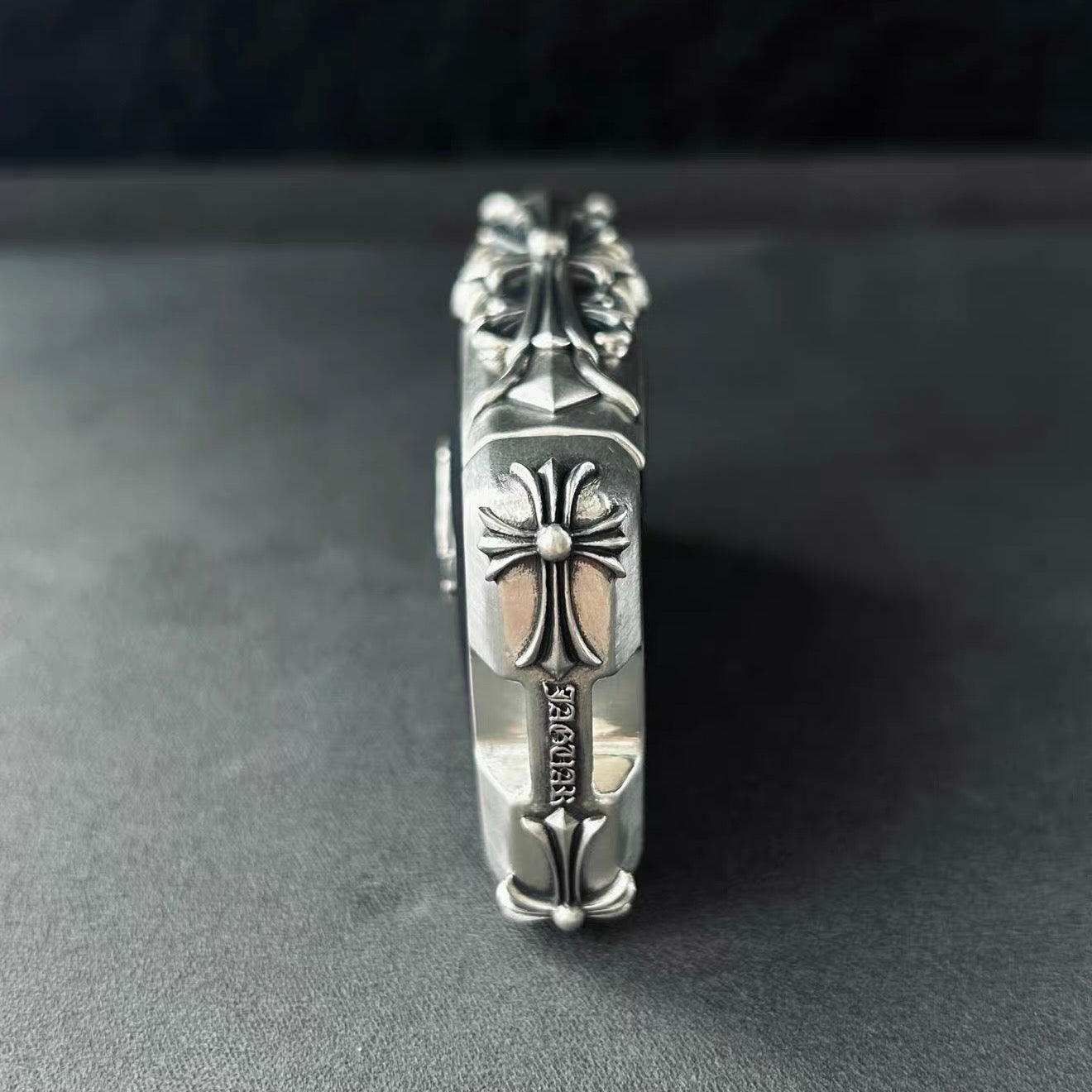 Side profile showing hand-finished floral scrollwork on 925 Sterling Silver frame