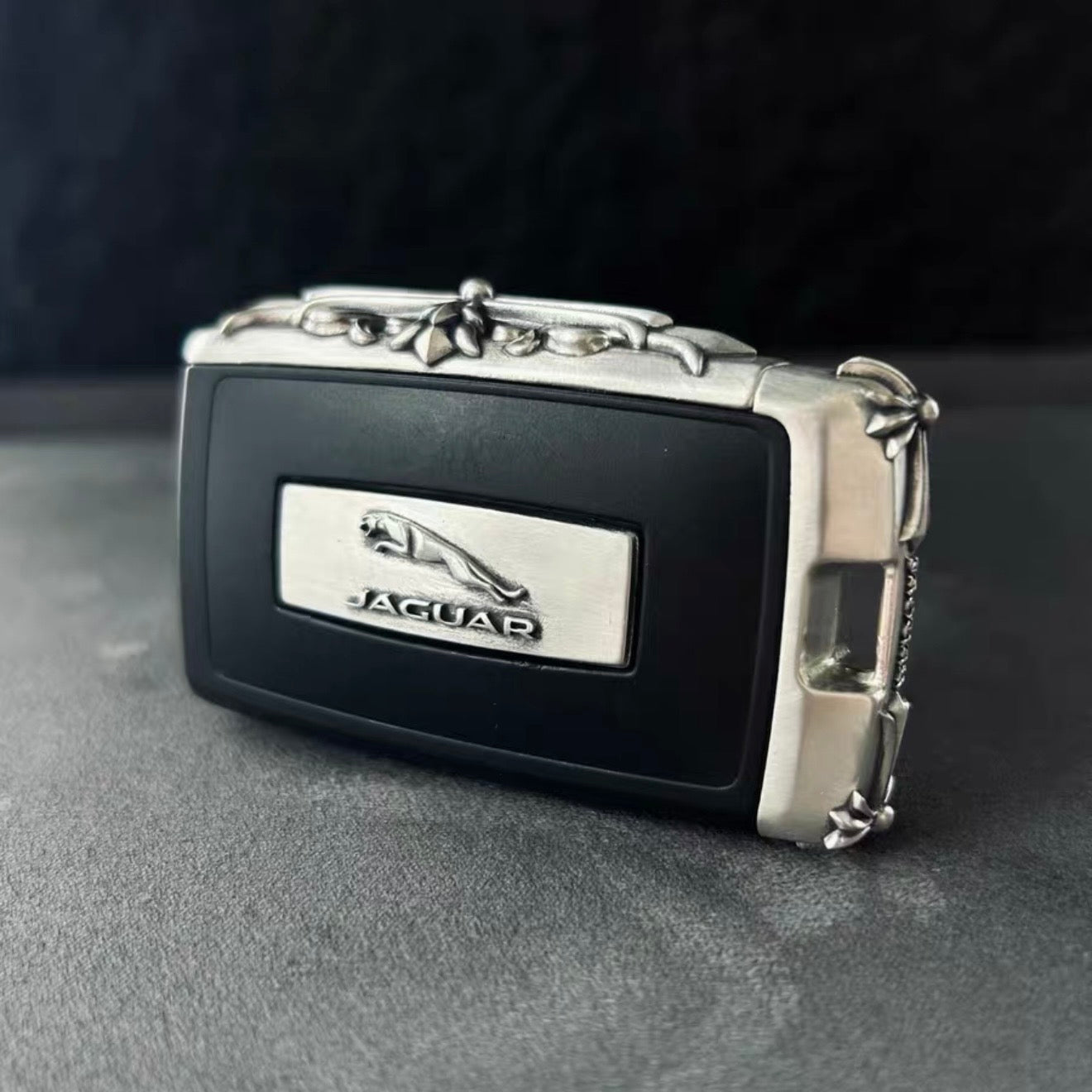Handcrafted Sterling Silver Jaguar Key Case with floral scrollwork engraving and leaping Jaguar emblem
