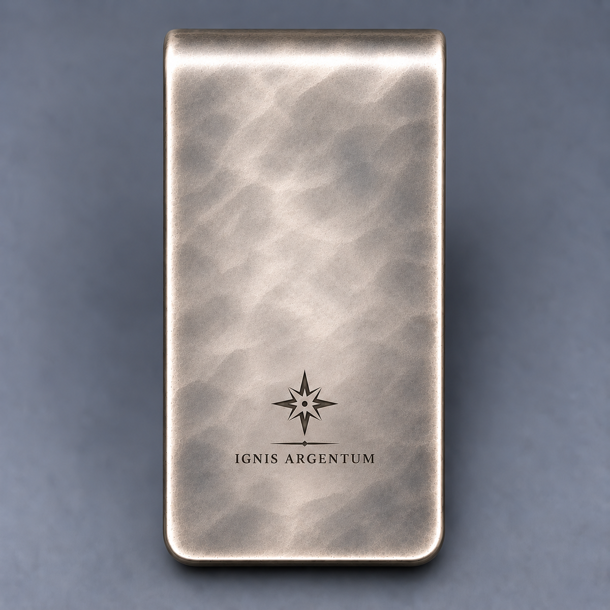 Back of hand-planished money clip with understated IGNIS ARGENTUM engraving