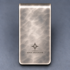 Back of hand-planished money clip with understated IGNIS ARGENTUM engraving