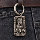 Close-up of the silver spring-gate ring linking Hades MYTHOS charm to a leather belt loop; charm and styling accessories sold separately