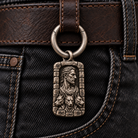 Silver spring-gate ring and Hades MYTHOS charm on a leather belt attachment over dark denim; charm and belt not included