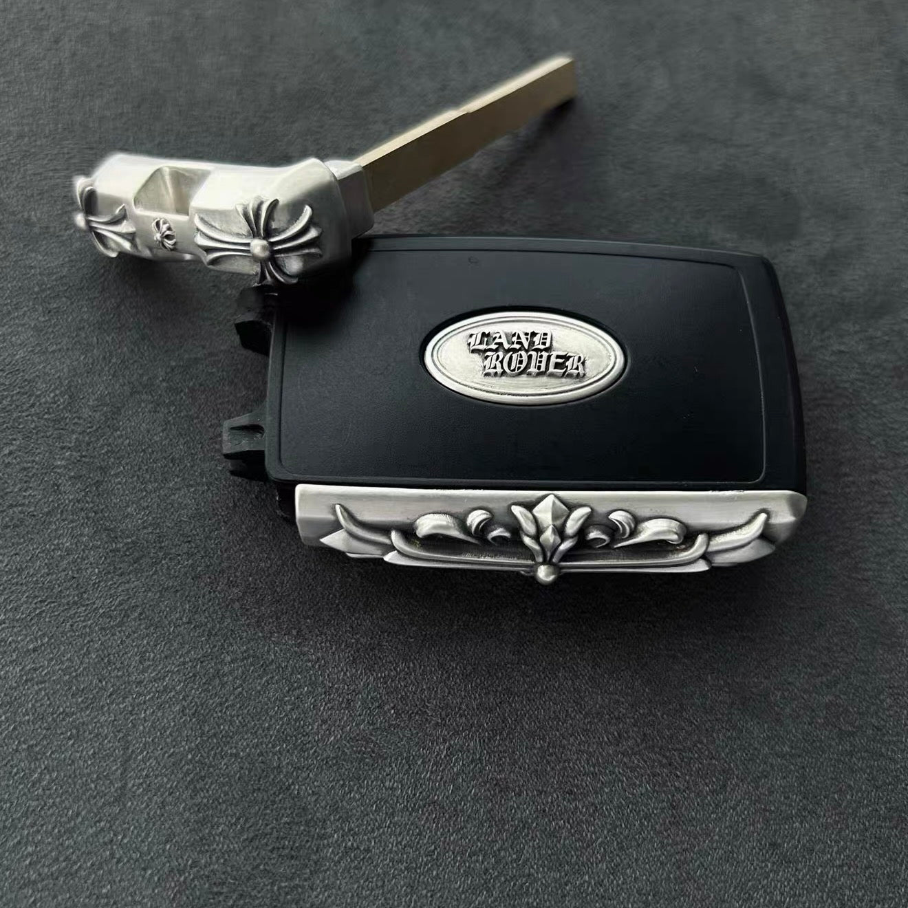 Open Land Rover key case showing internal mechanism with secure metal clips and precise key slot, demonstrating sturdy construction and perfect fit for original key