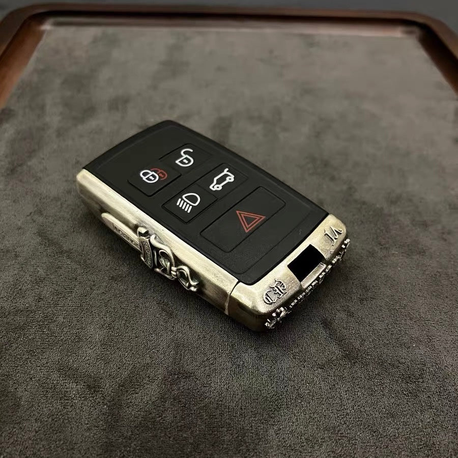 Back detail of the Land Rover 925 sterling silver key case featuring the preserved brand emblem and smooth polished silver surface.
