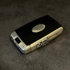 Front view of Land Rover sterling silver key case with sword-style hand-engraved borders and iconic oval logo, designed for Range Rover Sport 2018-2025