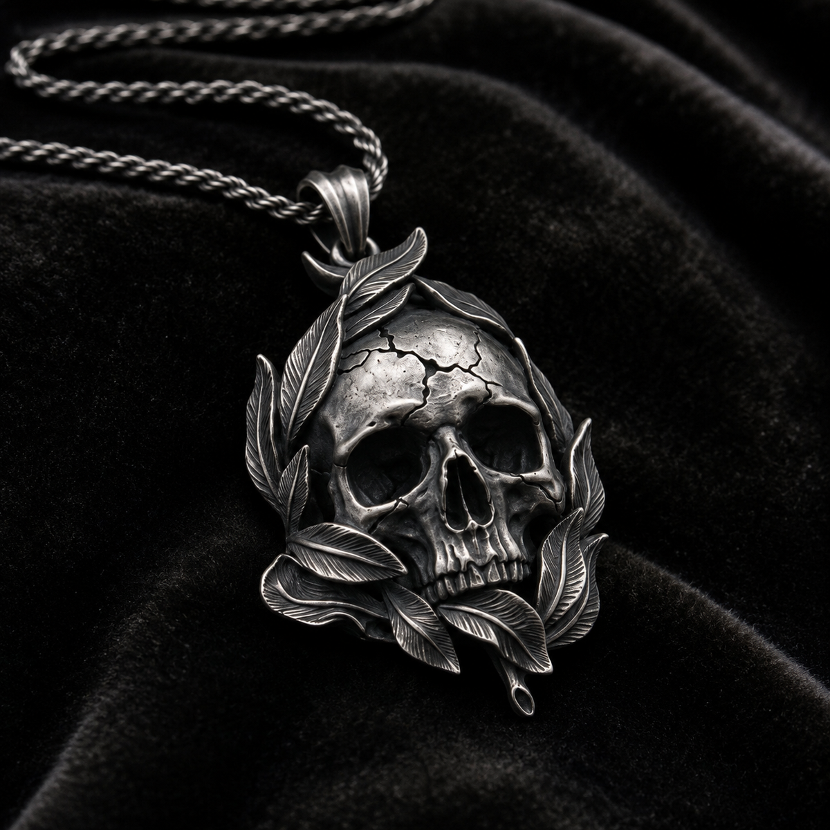 Memento Mori Skull & Feather Pendant, held for scale