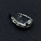 Mercedes classic oval key case overhead view showcasing symmetrical oval shape uniform engraving extension and intentional weight from top perspective