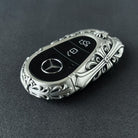Handmade silver key case for Mercedes back view showing brand engraving and metal texture with intentional weight and density