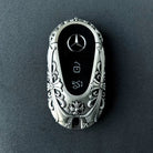 Mercedes rounded capsule key case diagonal rear angle showcasing uniform relief pattern and weighty precision from multiple perspectives