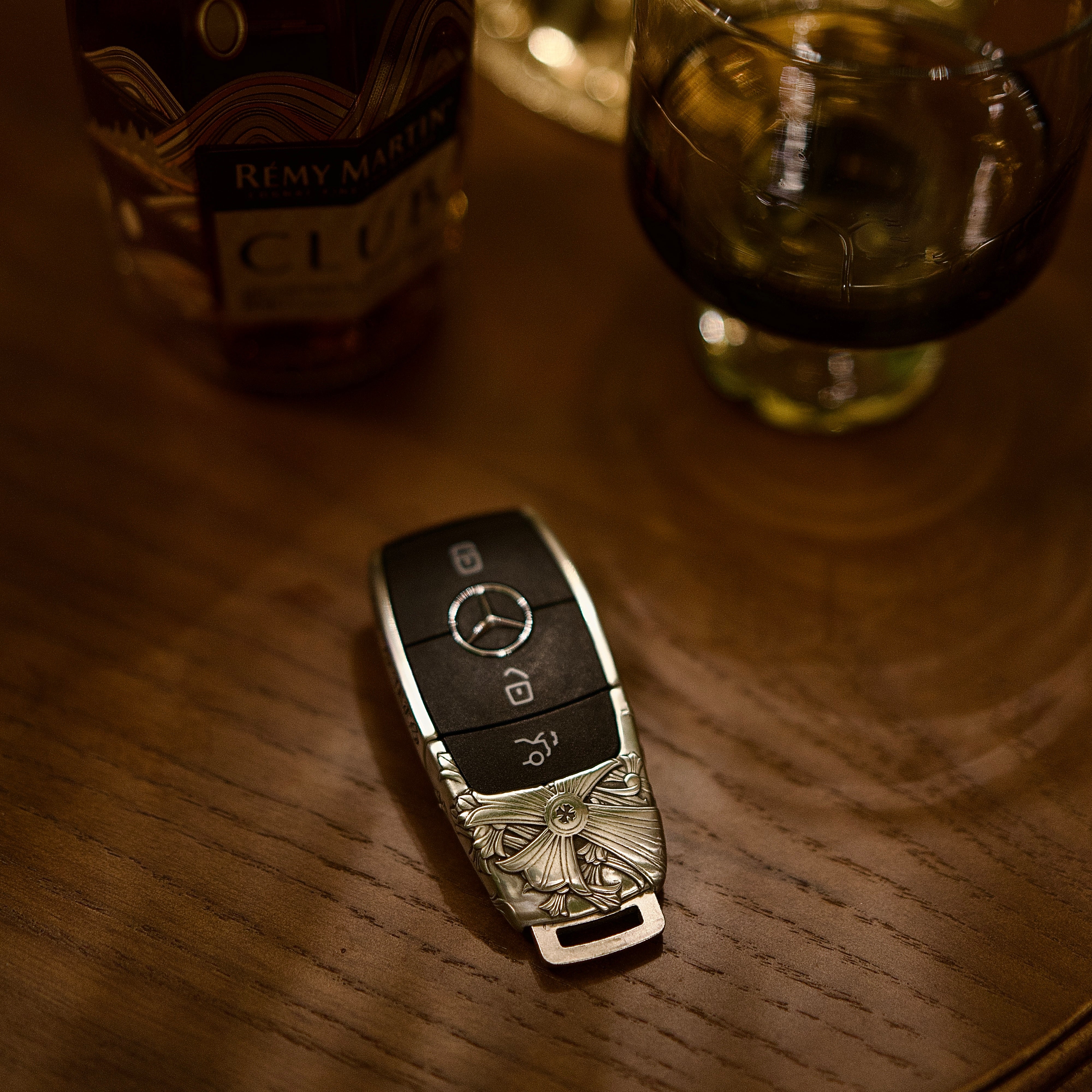 Mercedes key transformation before and after adding handcrafted silver case protection on wooden table showcasing refined finish and perfect fit
