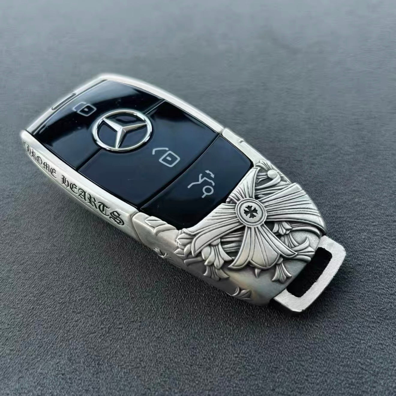 Mercedes Slim Rectangle handcrafted key case Nickel Silver front view with ornate floral cross engraving and three-pointed star emblem