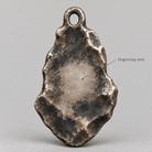 Ares keychain charm design preview, back view, showing the rear texture and engraving area