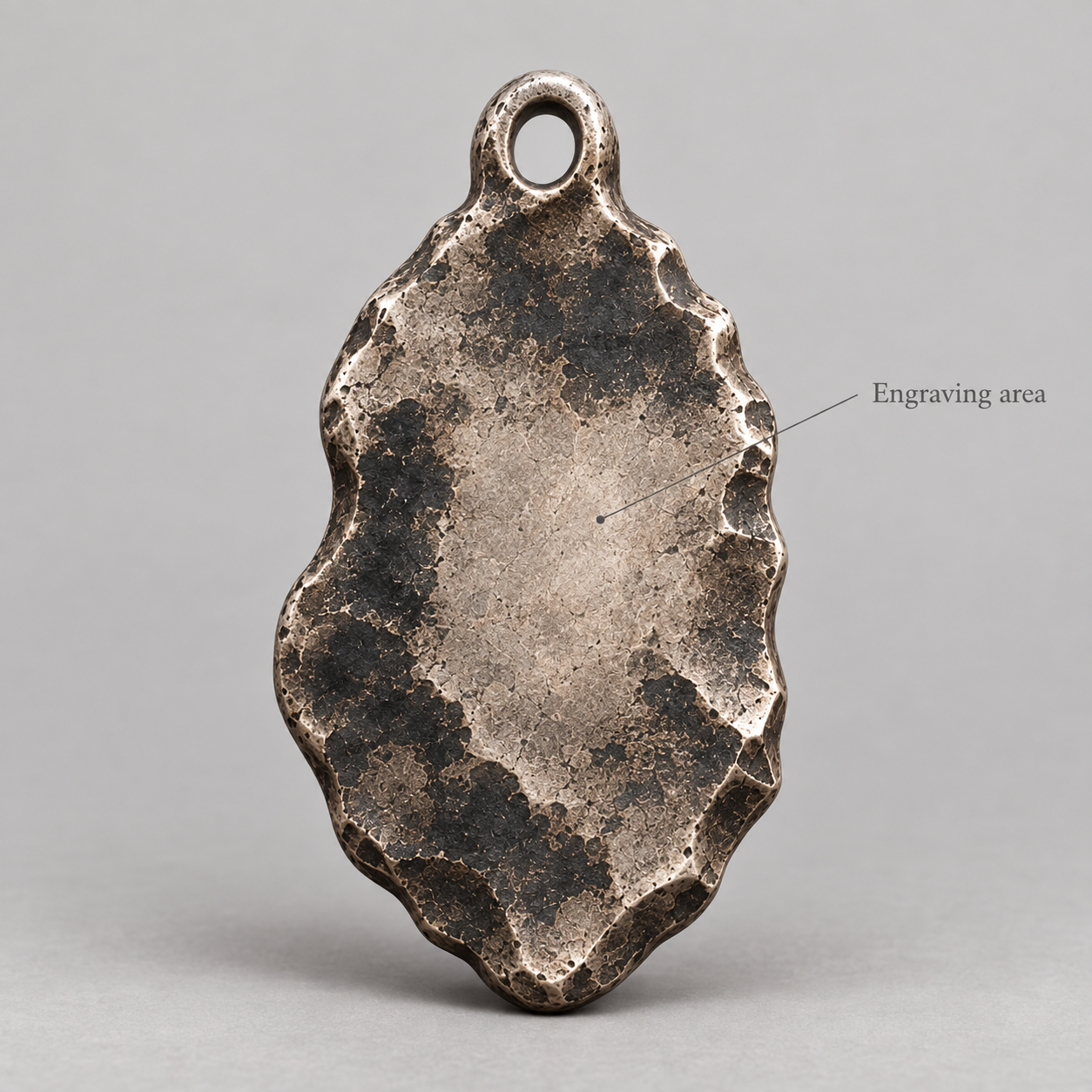 Artemis keychain charm design preview, back view, showing the rear texture and engraving area