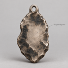 Artemis keychain charm design preview, back view, showing the rear texture and engraving area