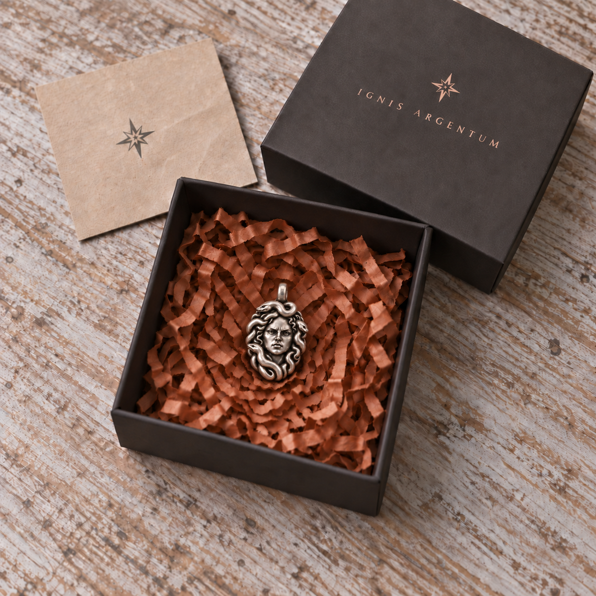 One Medusa pendant shown in an IGNIS ARGENTUM gift box; design visualization