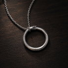 Ouroboros Serpent Circle Pendant, worn on a chain