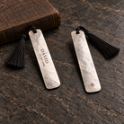 Front and back views of one bookmark; customer name and date on front, small brand logo on back