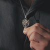 Video showing a dragon cross sterling silver pendant worn as a necklace