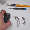 Installation demonstration of IGNIS ARGENTUM sterling silver key case for BMW slim edge key fob — precision-machined to match factory remote, showcasing seamless integration, refined finish, and straightforward assembly with included tool.