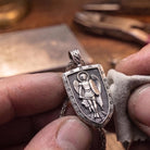 Saint Michael 925 Silver Shield Pendant, held for scale