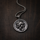 Serpent Skull Medallion Pendant, worn on a chain