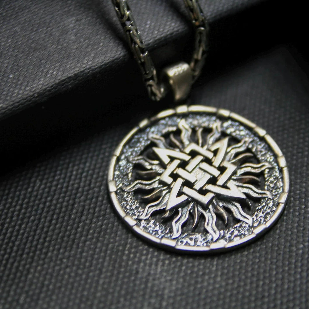Slavic Sun Wheel 925 Silver Pendant, displayed on a dark surface