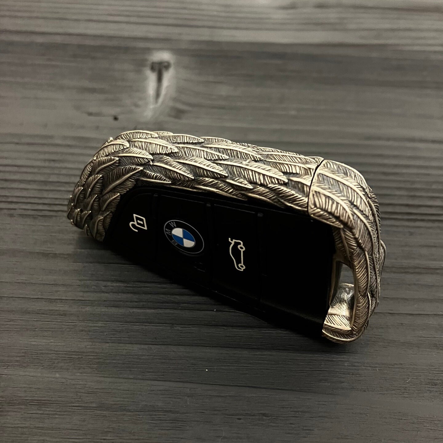 Three-button layout (lock/unlock/trunk) on handcrafted 925 Sterling Silver BMW key fob