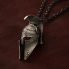 Spartan Helmet Talisman Pendant, displayed on a dark surface