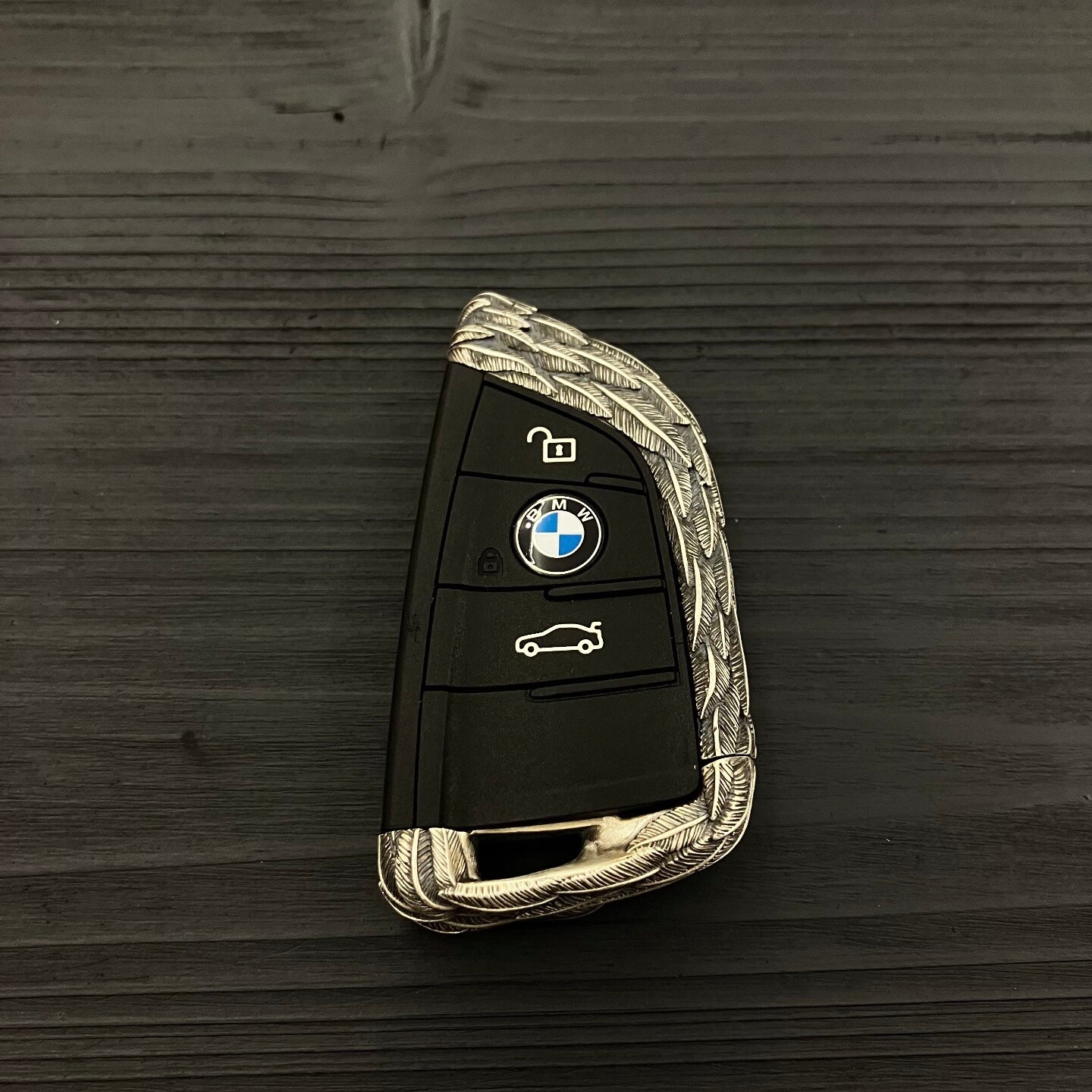 Back view showing continuous feather texture pattern on 925 Sterling Silver BMW key case