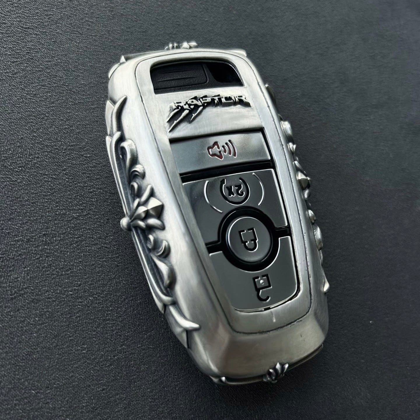 Sterling Silver Ford Bronco key case displayed on rugged outdoor surface, evoking wilderness heritage