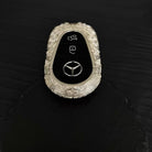 Side profile showing rounded capsule design and precision-crafted cloud texture pattern
