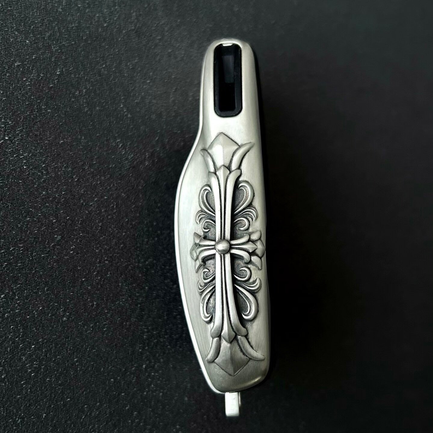 Top angle view of precision-crafted Porsche key case with oxidized accent details