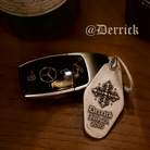 Personalized metal key tag shown with a car key